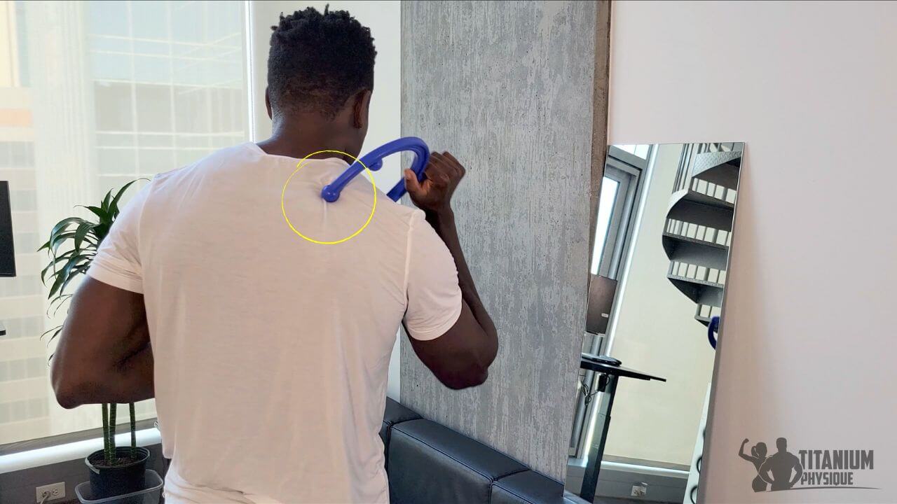 Nurudeen performs a levator scapulae self-massage exercise