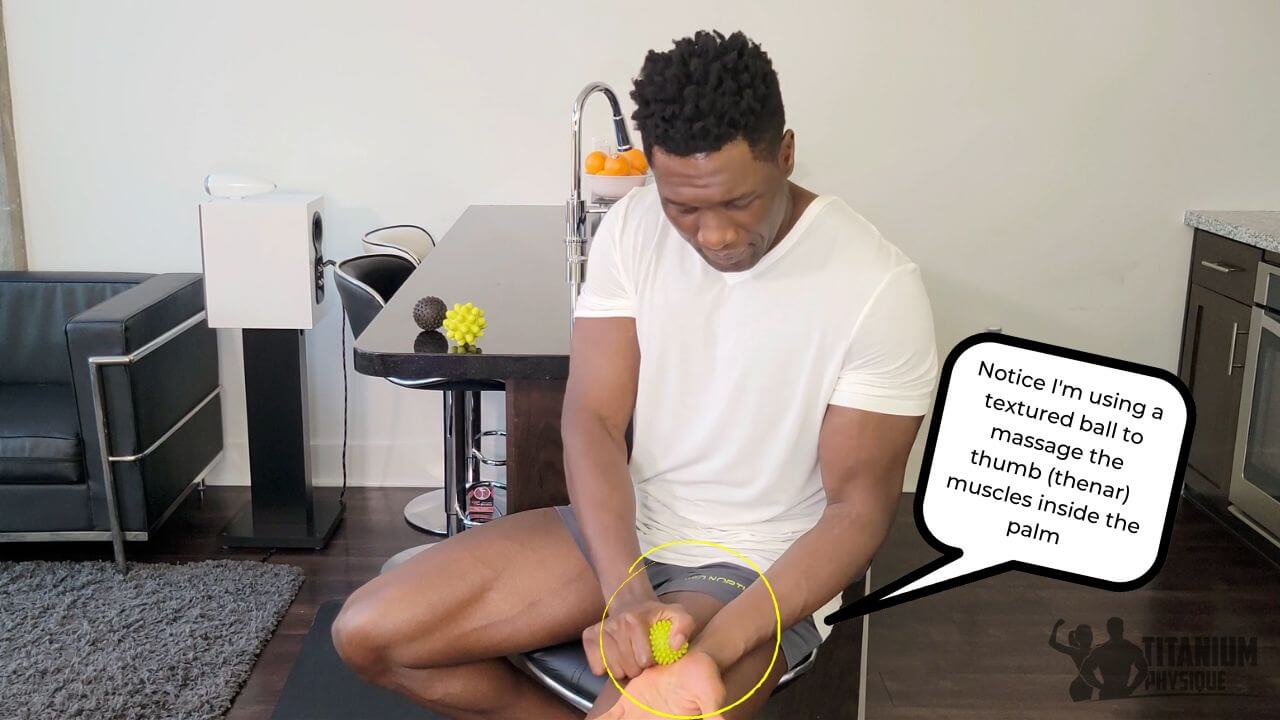 Nurudeen performs a thumb strain self-massage exercise on the thenar muscle